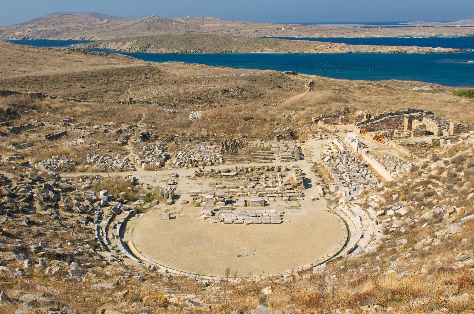 The ancient Greek theater of Delos Island with stone seating.