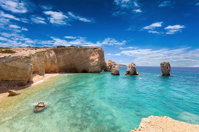 Rocky coastline of Koufonisia with crystal-clear waters and dramatic cliffs