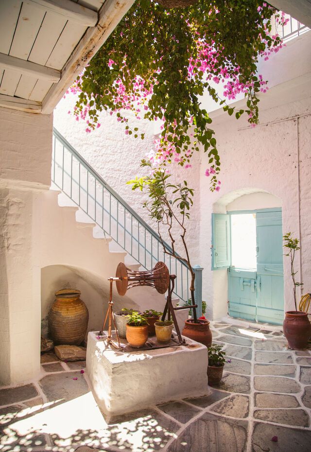 Charming narrow streets of Naxos Town with whitewashed buildings and colorful shutters