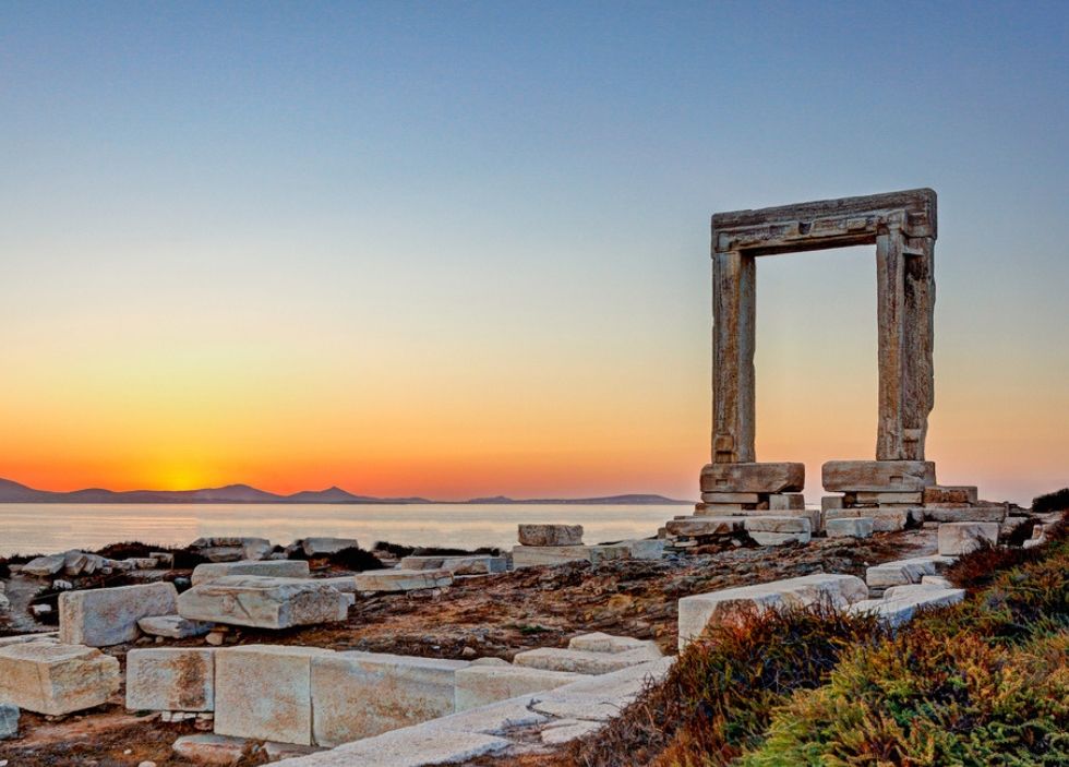 The ancient Temple of Apollo on Naxos, with the famous Portara gate framing the sunset