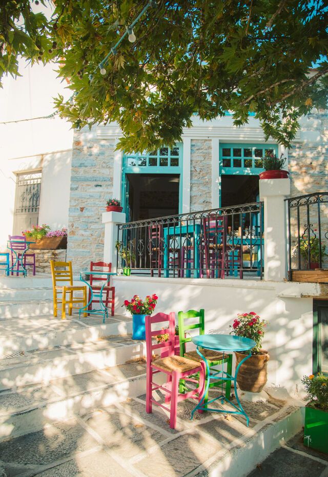 Charming narrow streets of Naxos Town with whitewashed buildings and colorful shutters