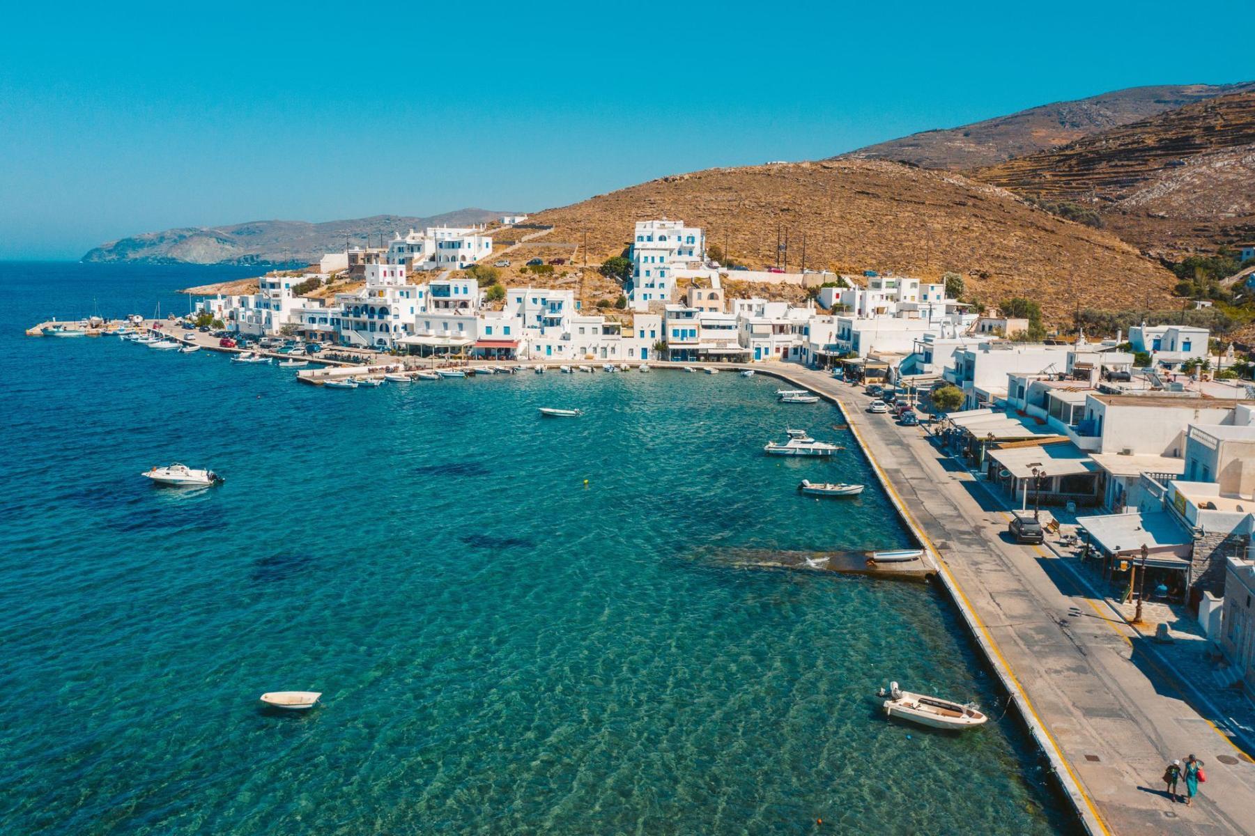 Aerial view of Tinos Port, showing the town, marina, and surrounding blue sea