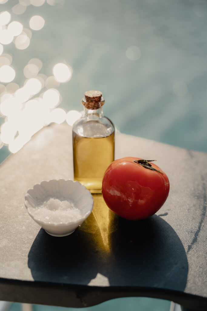 Fresh, locally-sourced ingredients such as Mediterranean herbs, seafood, and vegetables, beautifully arranged for a gourmet meal on a yacht in Mykonos