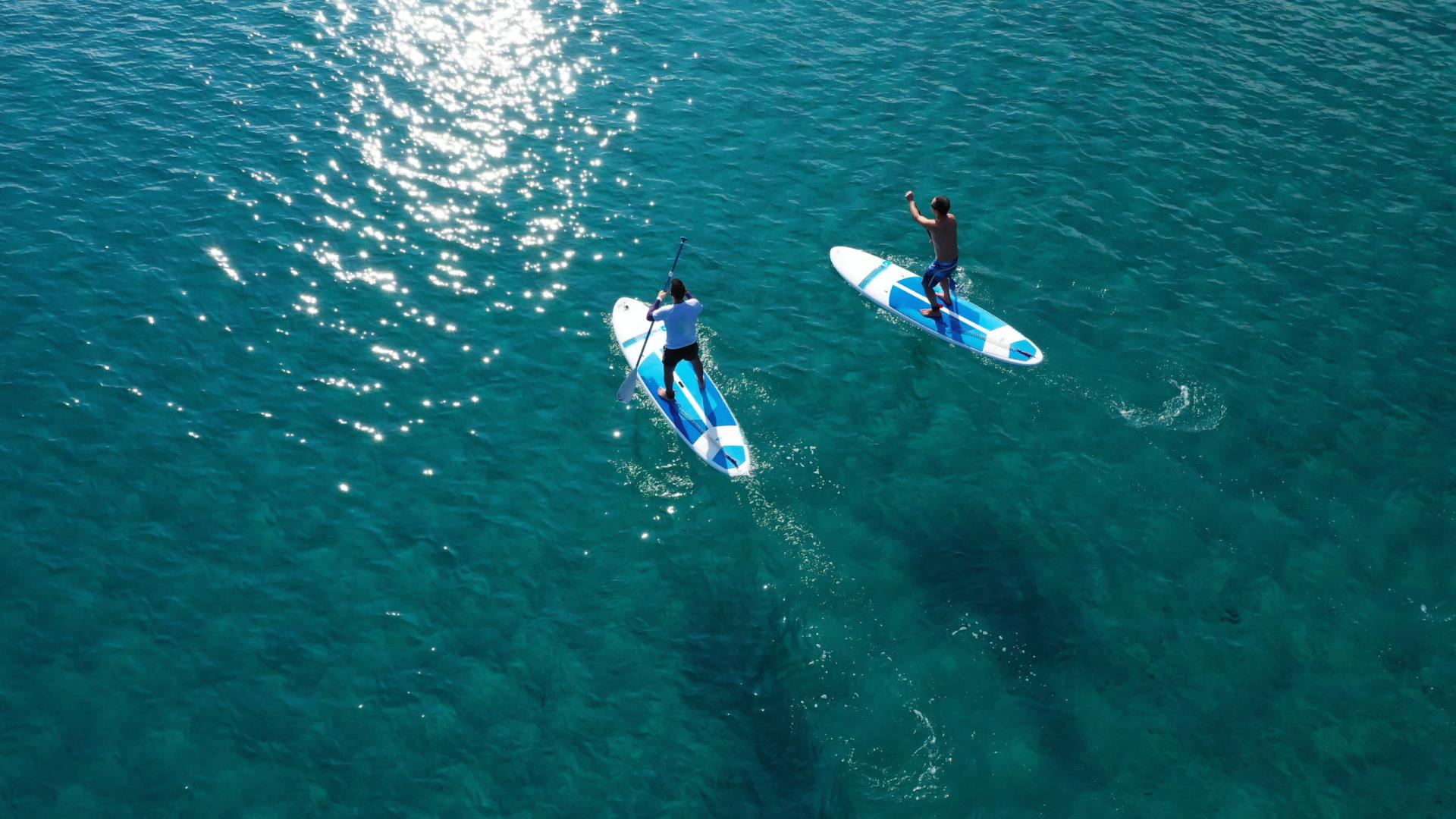 Crystal-Clear Waters and Paddleboarding Fun on a Mykonos Cruise