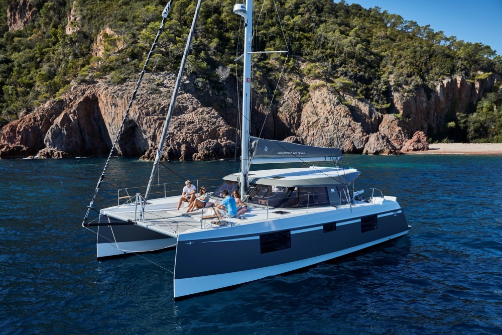 Guests enjoying a premium sailing experience on a Mykonos catamaran cruise.