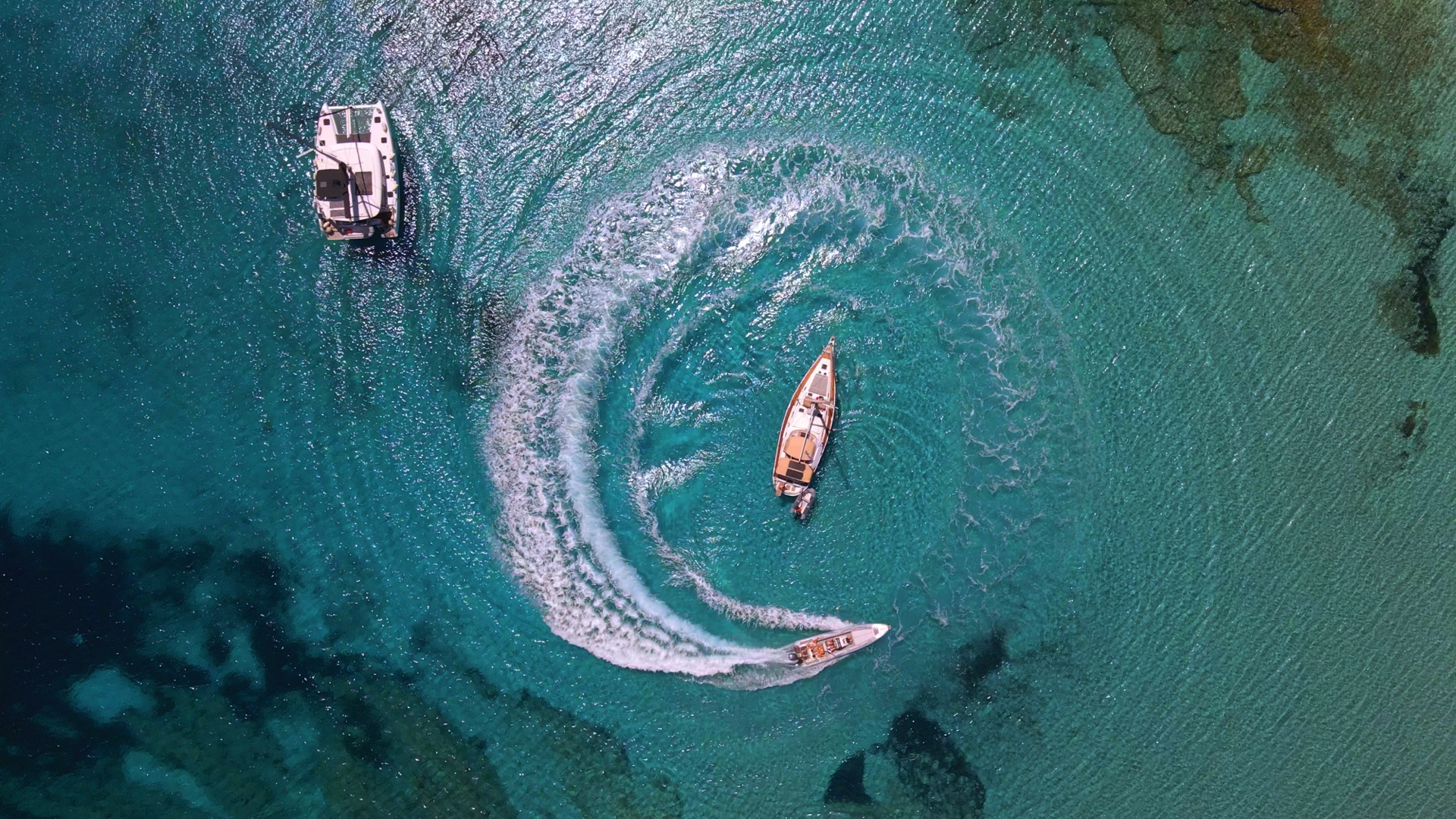 Ocean Star Yacht Anchored in a Hidden Cove – "The Ocean Star yacht anchored in a secluded Mykonos bay, surrounded by crystal-clear waters and rugged cliffs.