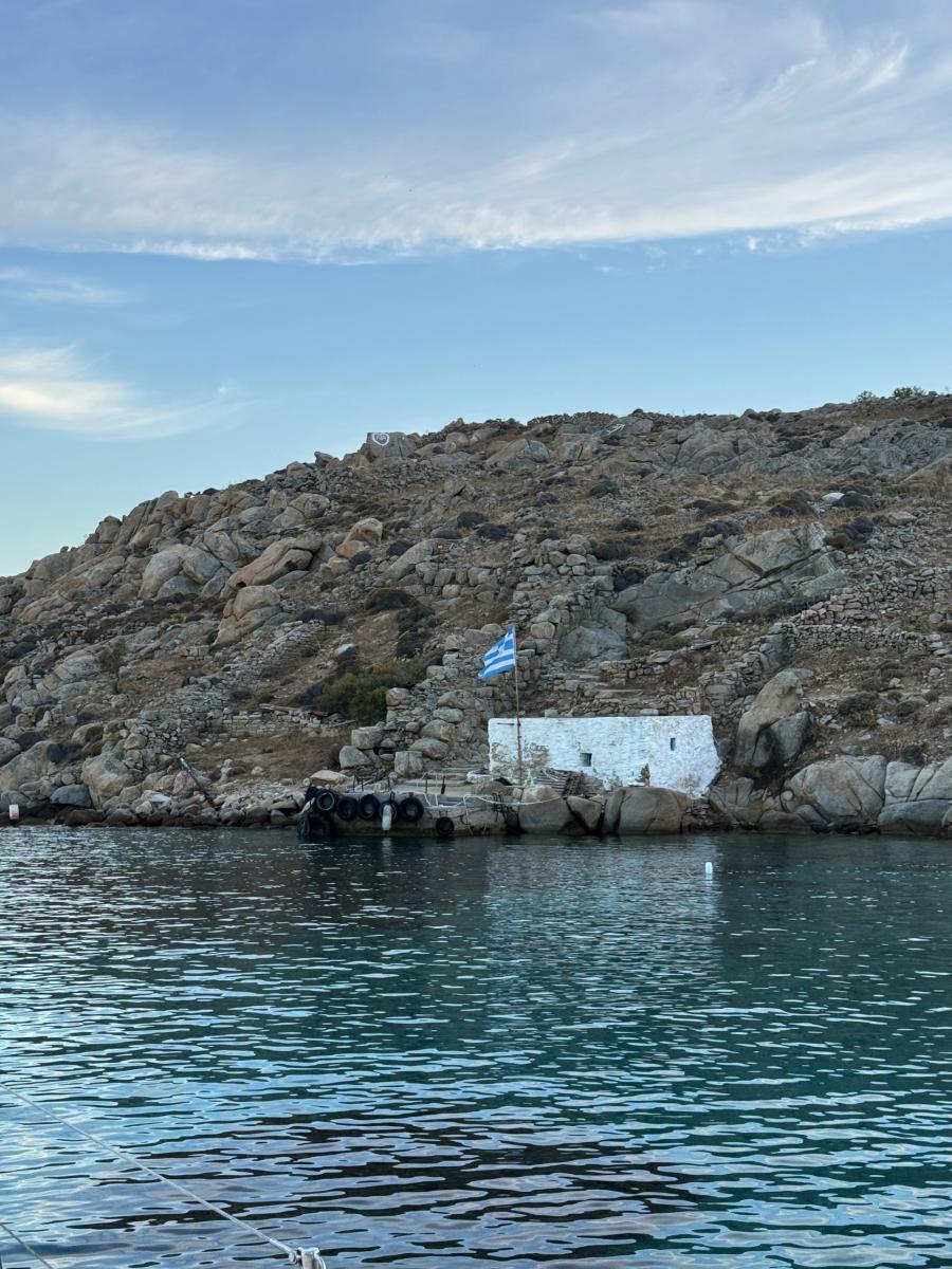 Exploring Delos Island During a Yacht Excursion – "Guests stepping onto the historic Delos Island from a luxury yacht, ready for an unforgettable cultural adventure.