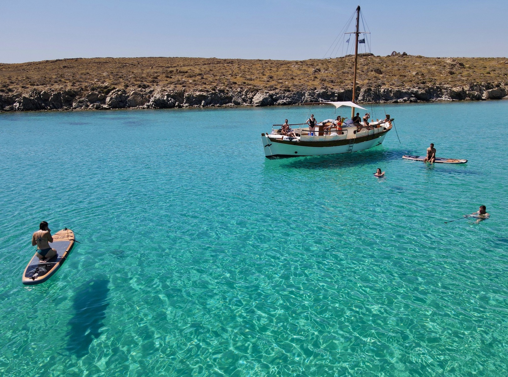 Authentic Mykonos experience – Explore the coastline on a traditional wooden caique