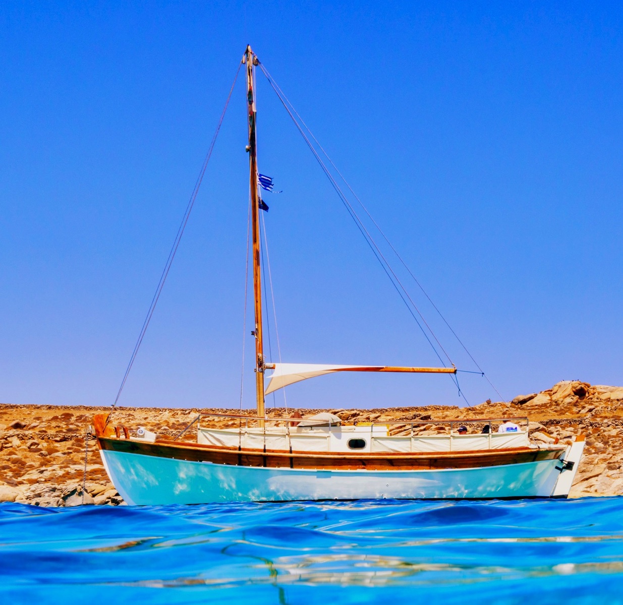 Authentic Mykonos experience – Explore the coastline on a traditional wooden caique