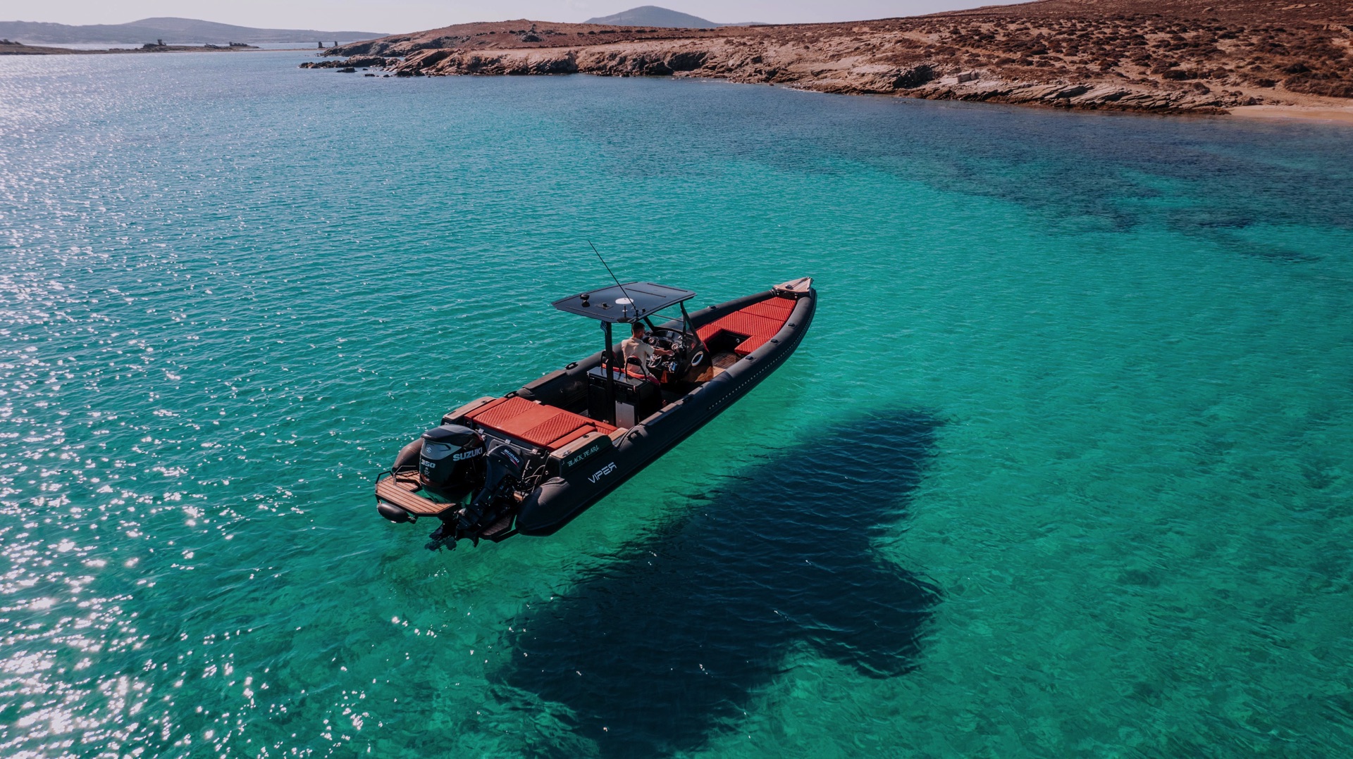 Scenic view of Delos island from a private RIB boat on a Mykonos cruise